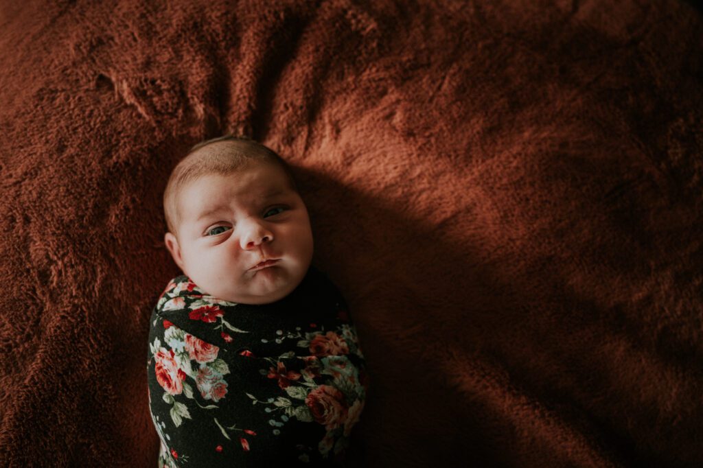 Mornings often work well as babies are generally more relaxed for your newborn in-home photo session